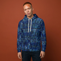 Person wearing a blue patterned hoodie against a brown background