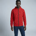 Person wearing a red hoodie with a subtle pattern on a gray background